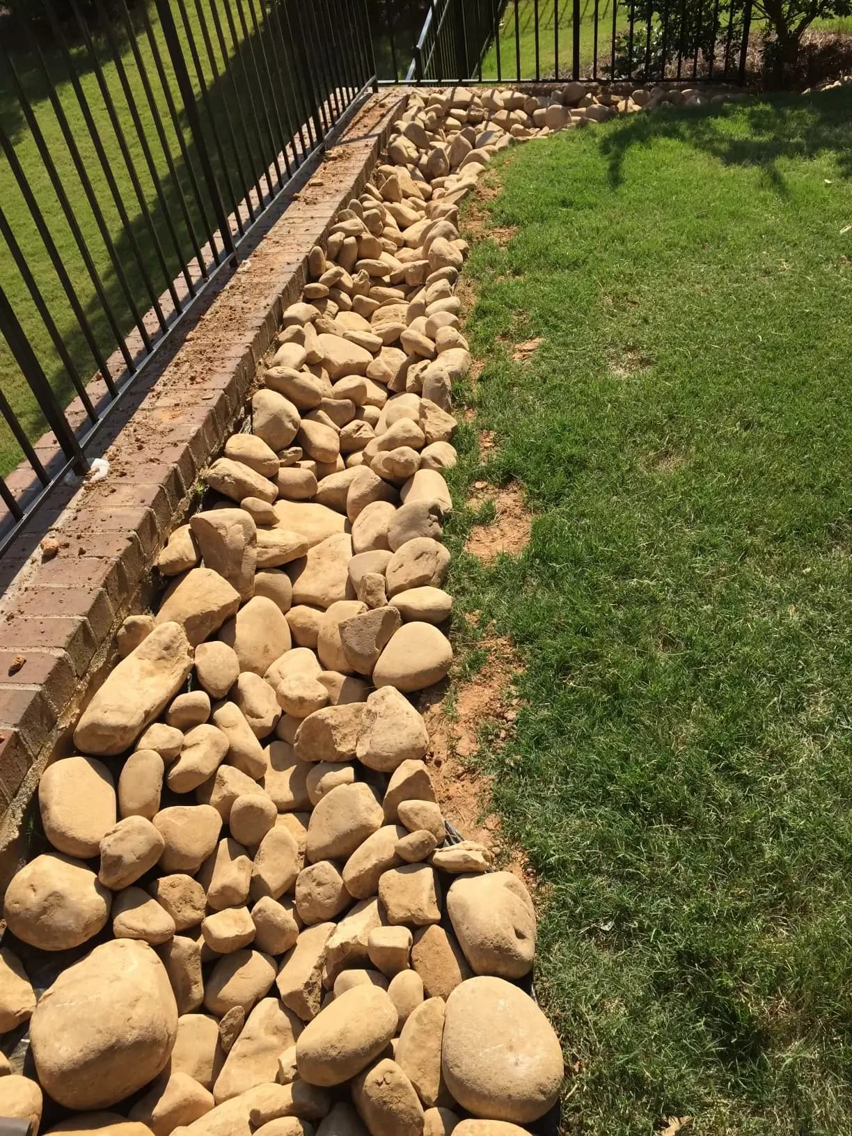 Backyard from top, showing off rocks for water drainage