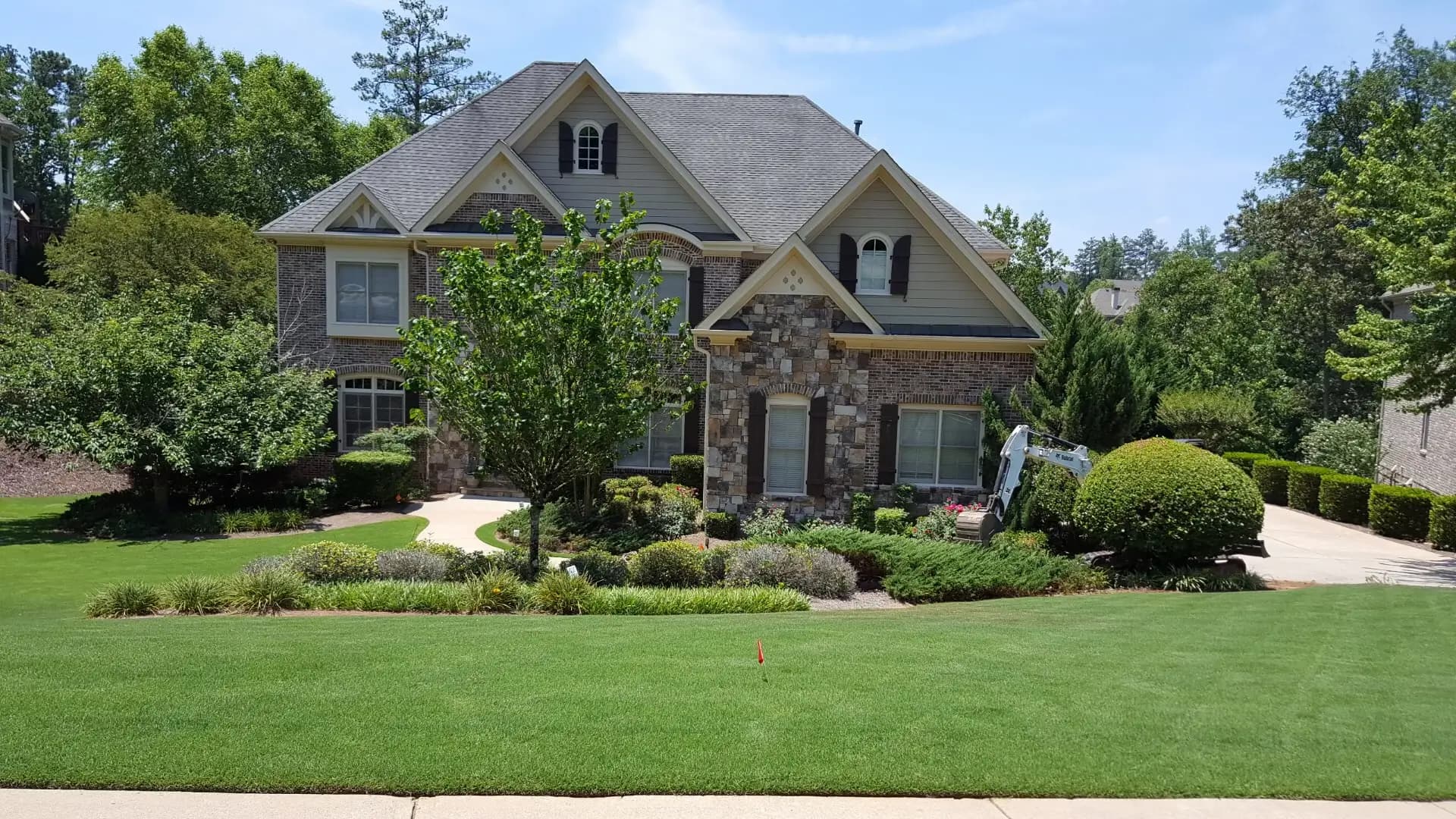 Front of a house, showing off the front yard